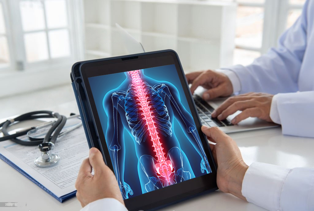 Image on spine and nervous system on an ipad with doctor holding ipad - Lighthouse Chiropractic and Wellness